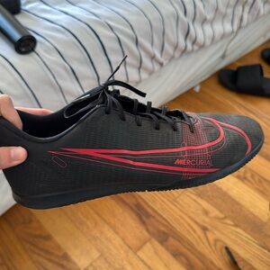 A Black with Red Nike Cleats